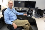 Eugene Marchand, physical security specialist, Defense Logistics Agency Installation Support at Richmond, Virginia, manages the Defense Supply Center Richmond Welcome Center and access control points by day and conducts raids with his wife in a virtual world by night. 