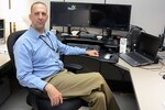 Eugene Marchand, physical security specialist, Defense Logistics Agency Installation Support at Richmond, Virginia, manages the Defense Supply Center Richmond Welcome Center and access control points by day and conducts raids with his wife in a virtual world by night. 