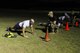 Tech. Sgt. Tom Cook (right) grades an Airman on his pushups during the Ranger Physical Fitness Test to kick off the Ranger Assessment Course at Fort Bliss, Texas July 10. Ranger School attendees must do 49 push-ups. (U.S. Army photo / Abigail Meyer)