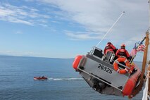 Boatswain's Mates David Edelson and Ben Ahlin prepare the 26325 for training during shakedown.