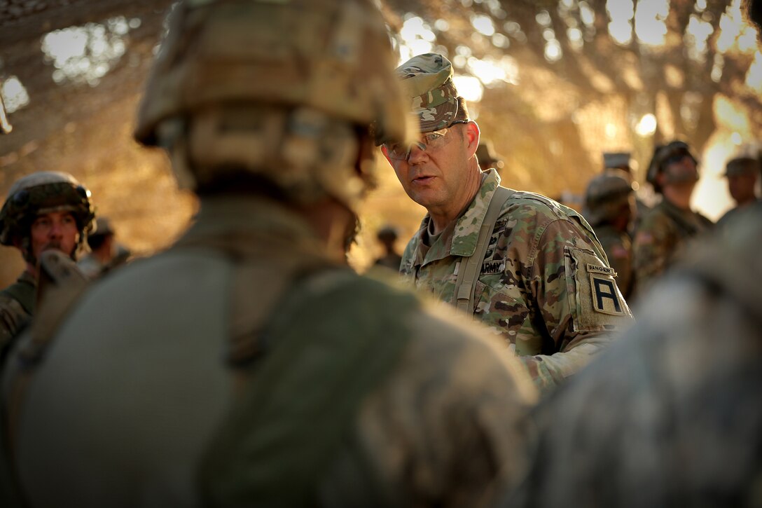 Maj. Gen. Todd McCaffrey, right, commanding general of First Army Division East, meets with Army Reserve Capt. Ciera Jackson, commander of the 208th Transportation (Palletized Loading System) Company, based in Marana, Arizona, during Combat Support Training Exercise 91-17-03, July 18, 2017, at Fort Hunter Liggett, Calif. The 208th Transportation Company is an Army Early Response Force unit that must be ready to deploy with very short notice. Approximately 5,000 Army Reserve and National Guard forces participated in the exercise. First Army provided about 65 observer coach/trainers to augment their Army Reserve partners at the 91st Training Division and assist in training the most capable, combat-ready and lethal federal reserve force in the history of the nation.
 (U.S. Army photo by Master Sgt. Anthony L. Taylor)