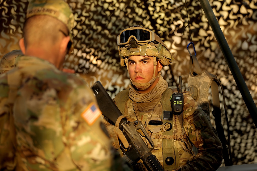 U.S. Army Reserve 2nd Lt. Donald Sotomayor-Seurer, Second Platoon Leader with the 208th Transportation (Palletized Loading System) Company, based in Marana, Arizona, listens to Maj. Gen. Todd McCaffrey, commanding general of First Army Division East, during Combat Support Training Exercise 91-17-03, July 18, 2017, at Fort Hunter Liggett, Calif. The 208th Transportation Company is an Army Early Response Force unit that must be ready to deploy with very short notice. Approximately 5,000 Army Reserve and National Guard forces participated in the exercise. First Army provided about 65 observer coach/trainers to augment their Army Reserve partners at the 91st Training Division and assist in training the most capable, combat-ready and lethal federal reserve force in the history of the nation.
 (U.S. Army photo by Master Sgt. Anthony L. Taylor)