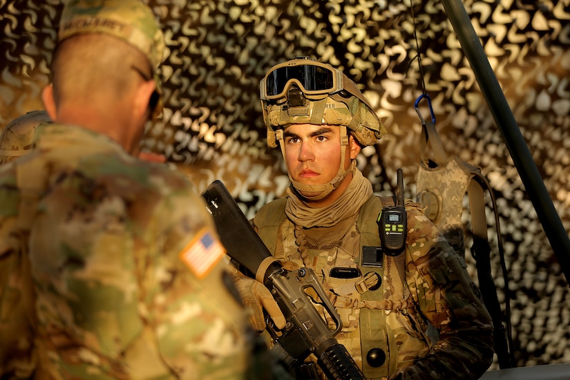 U.S. Army Reserve 2nd Lt. Donald Sotomayor-Seurer, Second Platoon Leader with the 208th Transportation (Palletized Loading System) Company, based in Marana, Arizona, listens to Maj. Gen. Todd McCaffrey, commanding general of First Army Division East, during Combat Support Training Exercise 91-17-03, July 18, 2017, at Fort Hunter Liggett, Calif. The 208th Transportation Company is an Army Early Response Force unit that must be ready to deploy with very short notice. Approximately 5,000 Army Reserve and National Guard forces participated in the exercise. First Army provided about 65 observer coach/trainers to augment their Army Reserve partners at the 91st Training Division and assist in training the most capable, combat-ready and lethal federal reserve force in the history of the nation.
 (U.S. Army photo by Master Sgt. Anthony L. Taylor)