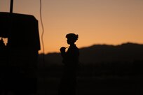 Staff Sgt. Shawn Allen, of the Army Reserve’s 946th Transportation Company, watches the sunset during Combat Support Training Exercise 91-17-03, July 18, 2017, Fort Hunter Liggett, Calif. Approximately 5,000 Army Reserve and National Guard forces participated in the exercise. First Army provided about 65 observer coach/trainers to augment their Army Reserve partners at the 91st Training Division and assist in training the most capable, combat-ready and lethal federal reserve force in the history of the nation. 
(U.S. Army photo by Master Sgt. Anthony L. Taylor)
