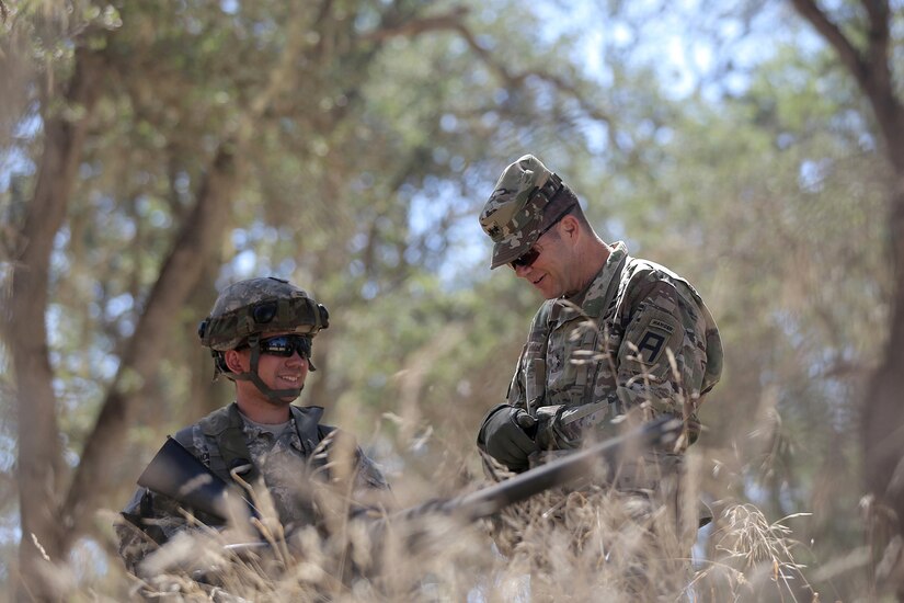 U.S. Army Reserve Spc. Adrick Montalvo, left, a Wheeled Vehicle Mechanic assigned to the 611th Quartermaster Company, based in Baltimore, Md., talks with Maj. Gen. Todd McCaffrey, commanding general of First Army Division East, during Combat Support Training Exercise 91-17-03, July 18, 2017, at Fort Hunter Liggett, Calif. Approximately 5,000 Army Reserve and National Guard forces participated in the exercise. First Army provided about 65 observer coach/trainers to augment their Army Reserve partners at the 91st Training Division and assist in training the most capable, combat-ready and lethal federal reserve force in the history of the nation.
(U.S. Army photo by Master Sgt. Anthony L. Taylor)