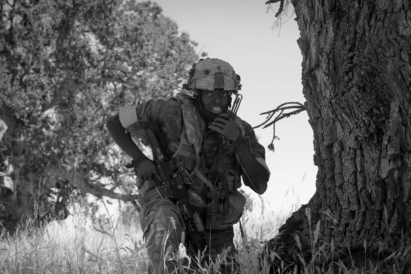 U.S. Army Staff Sgt. Andrew Burke, an infantryman with the 5th Battalion, 20th Infantry Regiment, based at Joint Base Lewis-McChord, Wash., calls his teammates, the opposing force to Army Reserve and National Guard forces, during Combat Support Training Exercise 91-17-03, July 18, 2017, at Fort Hunter Liggett, Calif. Approximately 5,000 Army Reserve and National Guard forces participated in the exercise. First Army provided about 65 observer coach/trainers to augment their Army Reserve partners at the 91st Training Division and assist in training the most capable, combat-ready and lethal federal reserve force in the history of the nation. 
(U.S. Army photo by Master Sgt. Anthony L. Taylor)