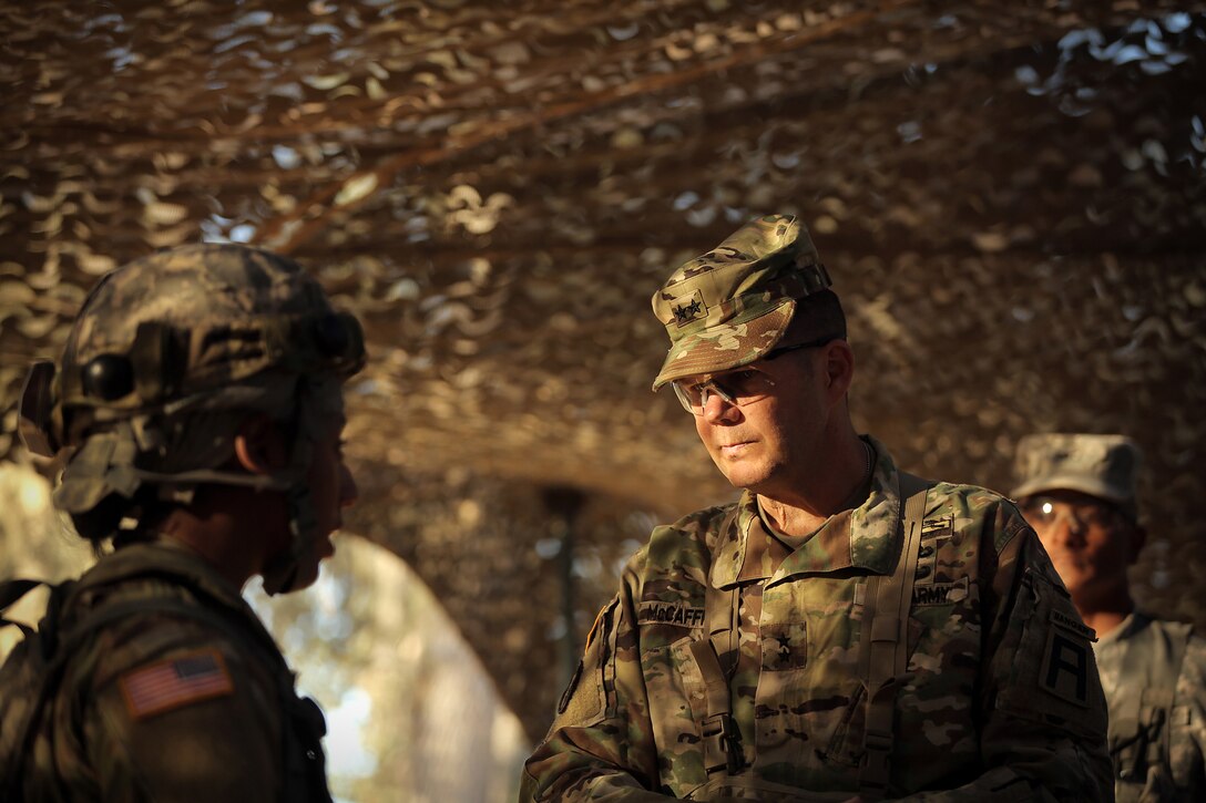 Maj. Gen. Todd McCaffrey, right, commanding general of First Army Division East, meets with Army Reserve Capt. Ciera Jackson, commander of the 208th Transportation (Palletized Loading System) Company based in Marana, Arizona, during Combat Support Training Exercise 91-17-03, July 18, 2017, at Fort Hunter Liggett, Calif. The 208th Transportation Company is an Army Early Response Force unit that must be ready to deploy with very short notice. Approximately 5,000 Army Reserve and National Guard forces participated in the exercise. First Army provided about 65 observer coach/trainers to augment their Army Reserve partners at the 91st Training Division and assist in training the most capable, combat-ready and lethal federal reserve force in the history of the nation. 
(U.S. Army photo by Master Sgt. Anthony L. Taylor)