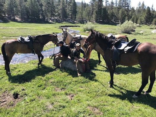 Members of the Vandenberg Mounted Horse Patrol and their respective Military Working Horses take a break during a recovery mission, June 29, 2017, Lone Pine, Calif. The Vandenberg Mounted Horse Patrol was requested nearly a week after a RQ-4 Global Hawk unmanned surveillance aircraft assigned to the 9th Reconnaissance Wing at Beale Air Force Base crashed during a trip back to its home station, June 21. (courtesy photo)