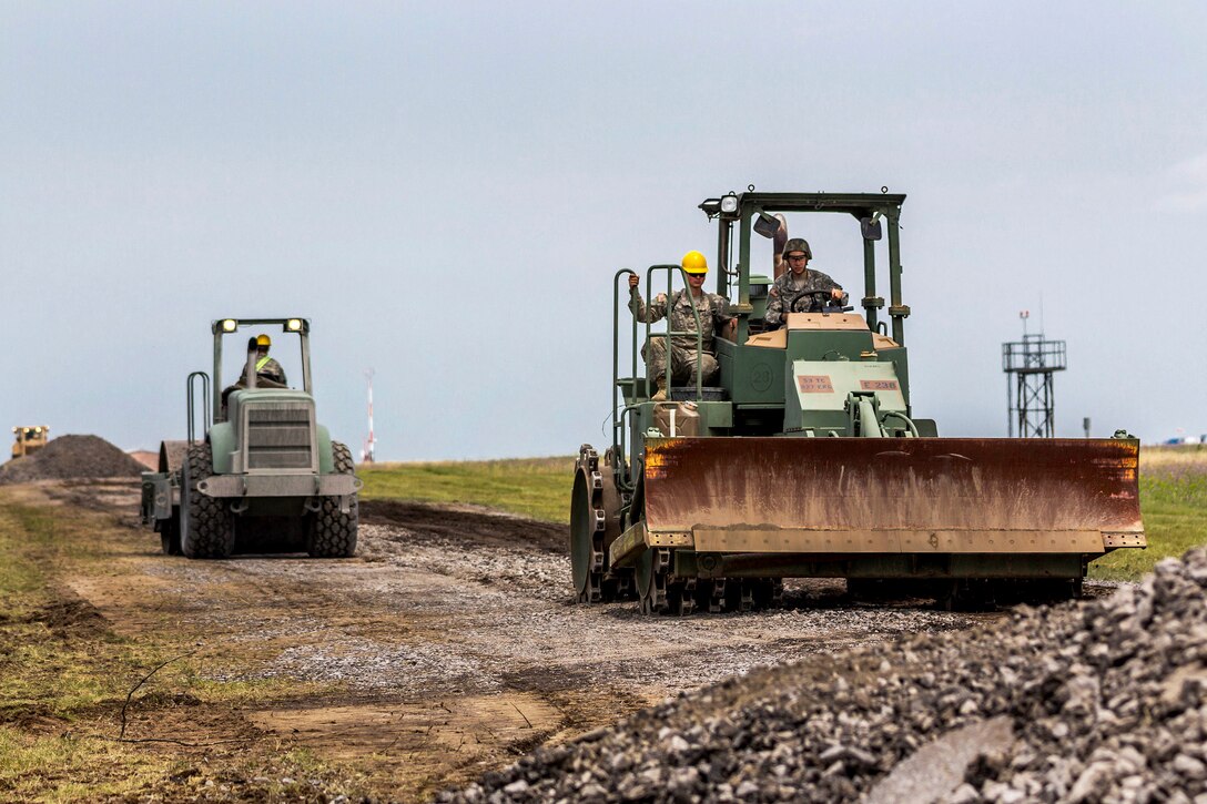 New York Army National Guardsmen operate heavy equipment to tear apart and regrade a road during their annual training at Fort Drum, N.Y., July 19th, 2017. Army National Guard photo by Sgt. Harley Jelis