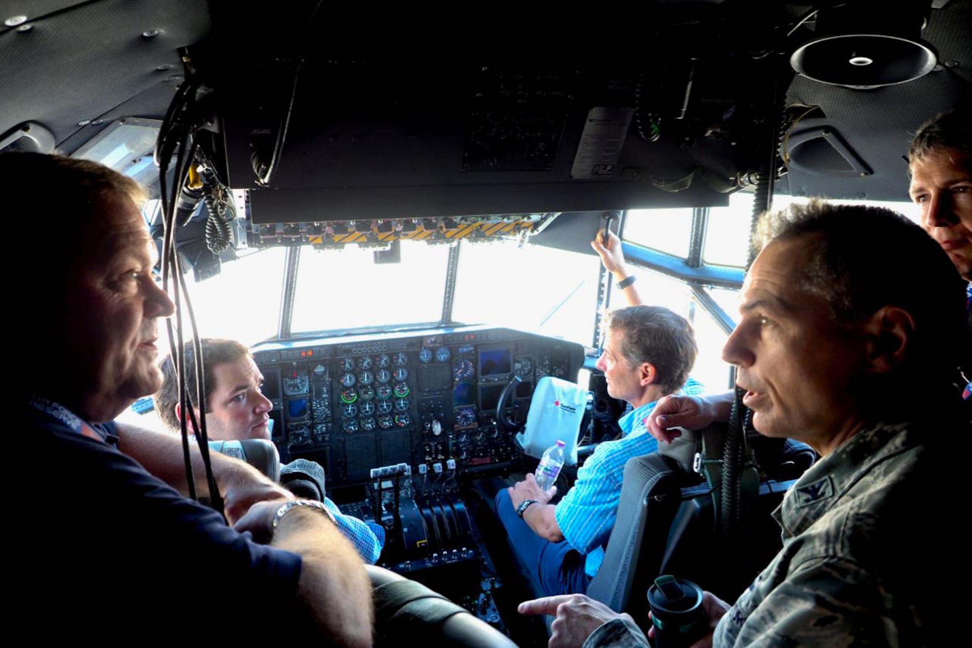 Col. Tony Polashek (right) 934th Airlift Wing commander, talks with Honorary Commanders in the cockpit of a C-130.
(Air Force Photo/Paul Zadach)