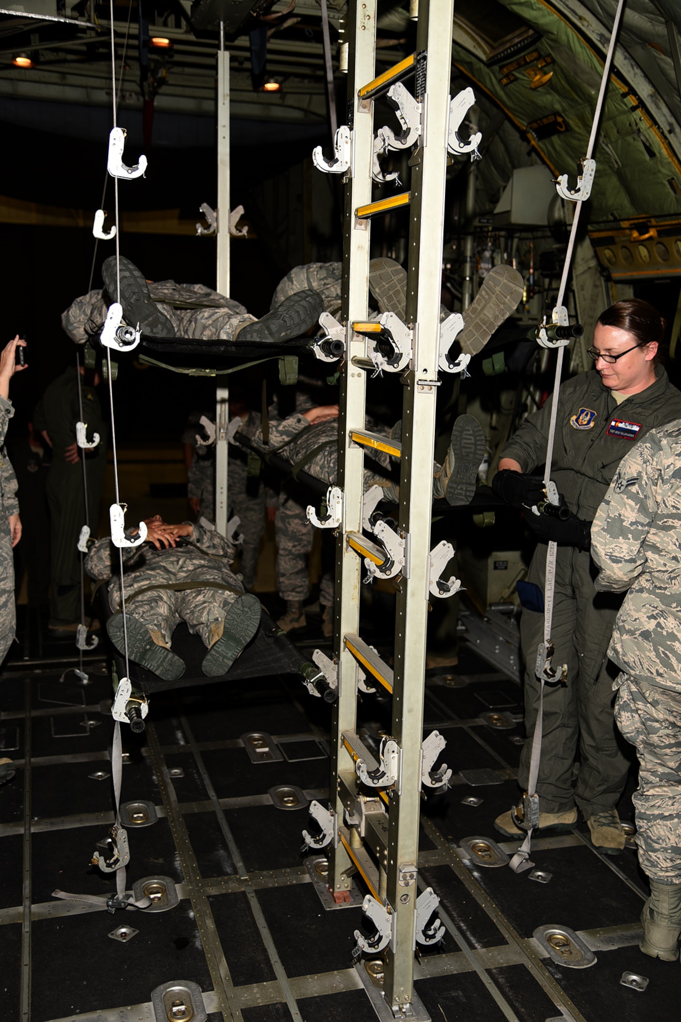 PETERSON AIR FORCE BASE, Colo. – The 21st Medical Group, along with the 302nd Airlift Wing, conducted joint training with Airmen from the U.S. Air Force Academy and Schriever Air Force Base to show proper loading and unloading procedures for casualties on a C-130 Hercules aircraft, July 14, 2017 at Peterson AFB, Colorado. Wounded Airmen can be stacked five high and flown to medical facilities for treatment around the world.(U.S. Air Force photo by Robb Lingley)