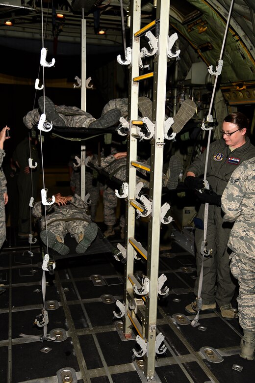 PETERSON AIR FORCE BASE, Colo. – The 21st Medical Group, along with the 302nd Airlift Wing, conducted joint training with Airmen from the U.S. Air Force Academy and Schriever Air Force Base to show proper loading and unloading procedures for casualties on a C-130 Hercules aircraft, July 14, 2017 at Peterson AFB, Colorado. Wounded Airmen can be stacked five high and flown to medical facilities for treatment around the world.(U.S. Air Force photo by Robb Lingley)