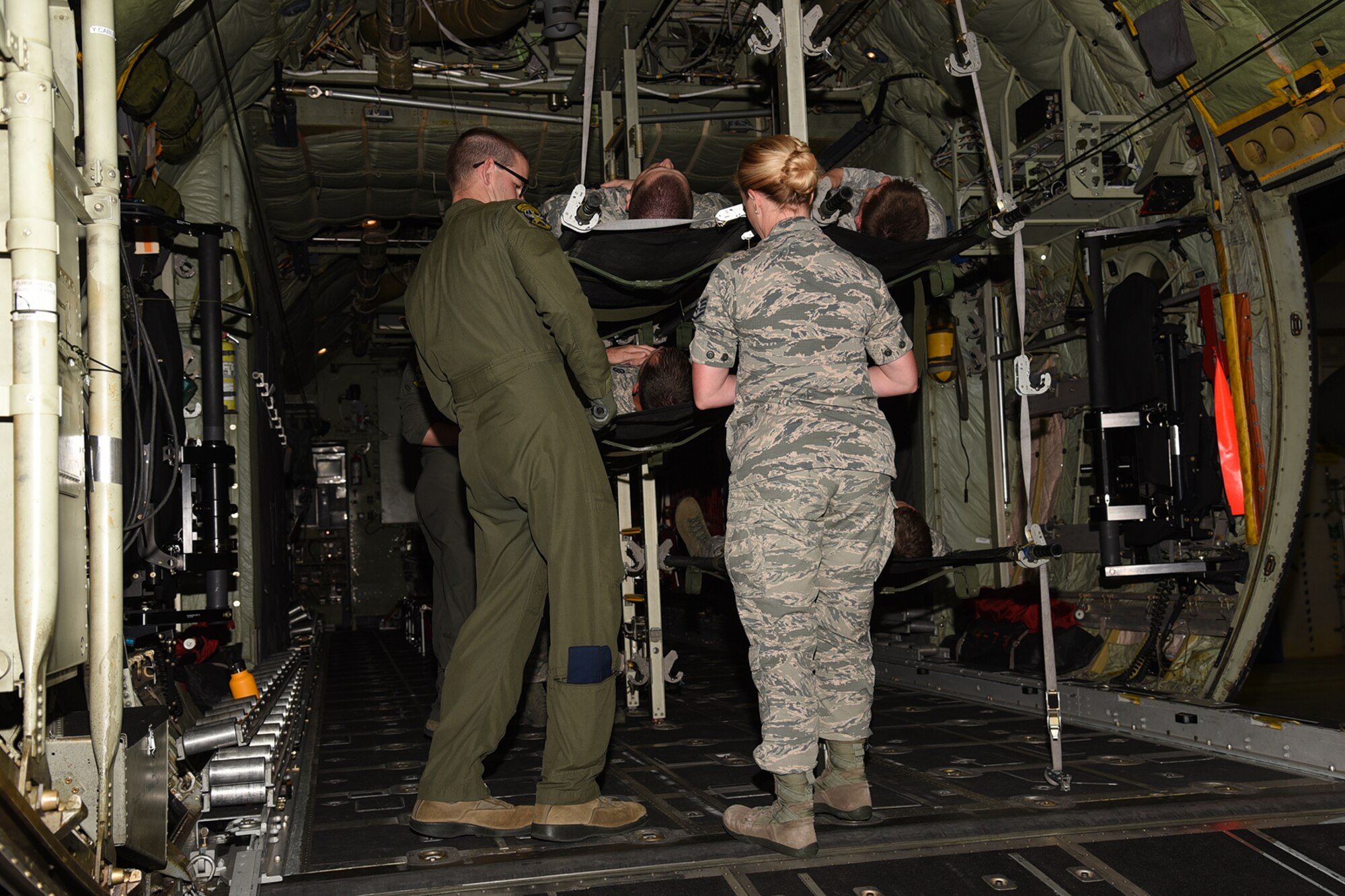 PETERSON AIR FORCE BASE, Colo. – The 21st Medical Group, along with the 302nd Airlift Wing, conducted joint training with Airmen from the U.S. Air Force Academy and Schriever Air Force Base to show proper loading and unloading procedures for casualties on a C-130 Hercules aircraft, July 14, 2017 at Peterson AFB, Colorado. The training helps for prepare Airmen for real world contingencies. (U.S. Air Force photo by Robb Lingley)