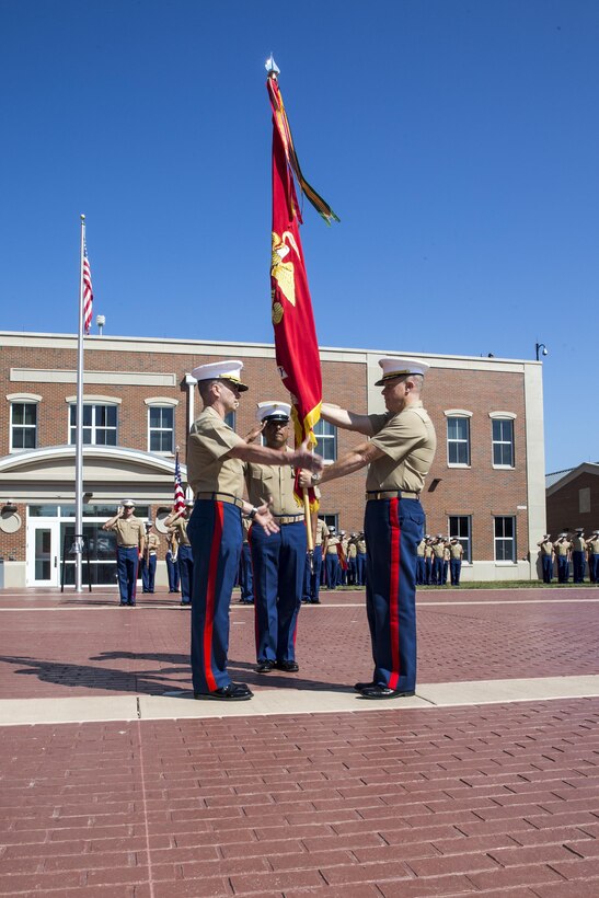 U.S. Marine Corps Col. Rod Brewster, right, outgoing company commander for Marine Corps Embassy Security Group (MCESG), relinquishes command to Col. Michael C. Taylor, incoming company commander, during a change of command ceremony at MCESG, Marine Corps Base Quantico, Va., July 19, 2017. The ceremony was held in order to signify the transition of command from Brewster to Taylor. (U.S. Marine Corps photo by Lance Cpl. Cristian L. Ricardo)