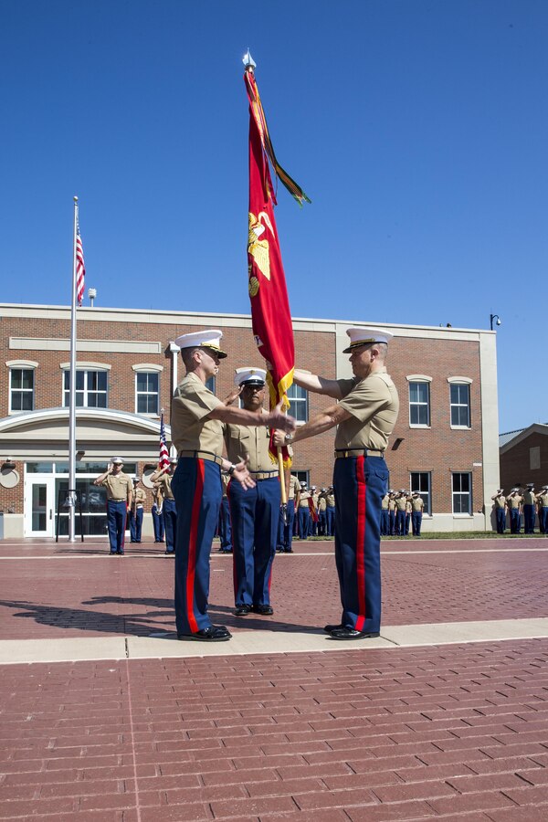 U.S. Marine Corps Col. Rod Brewster, right, outgoing company commander for Marine Corps Embassy Security Group (MCESG), relinquishes command to Col. Michael C. Taylor, incoming company commander, during a change of command ceremony at MCESG, Marine Corps Base Quantico, Va., July 19, 2017. The ceremony was held in order to signify the transition of command from Brewster to Taylor. (U.S. Marine Corps photo by Lance Cpl. Cristian L. Ricardo)