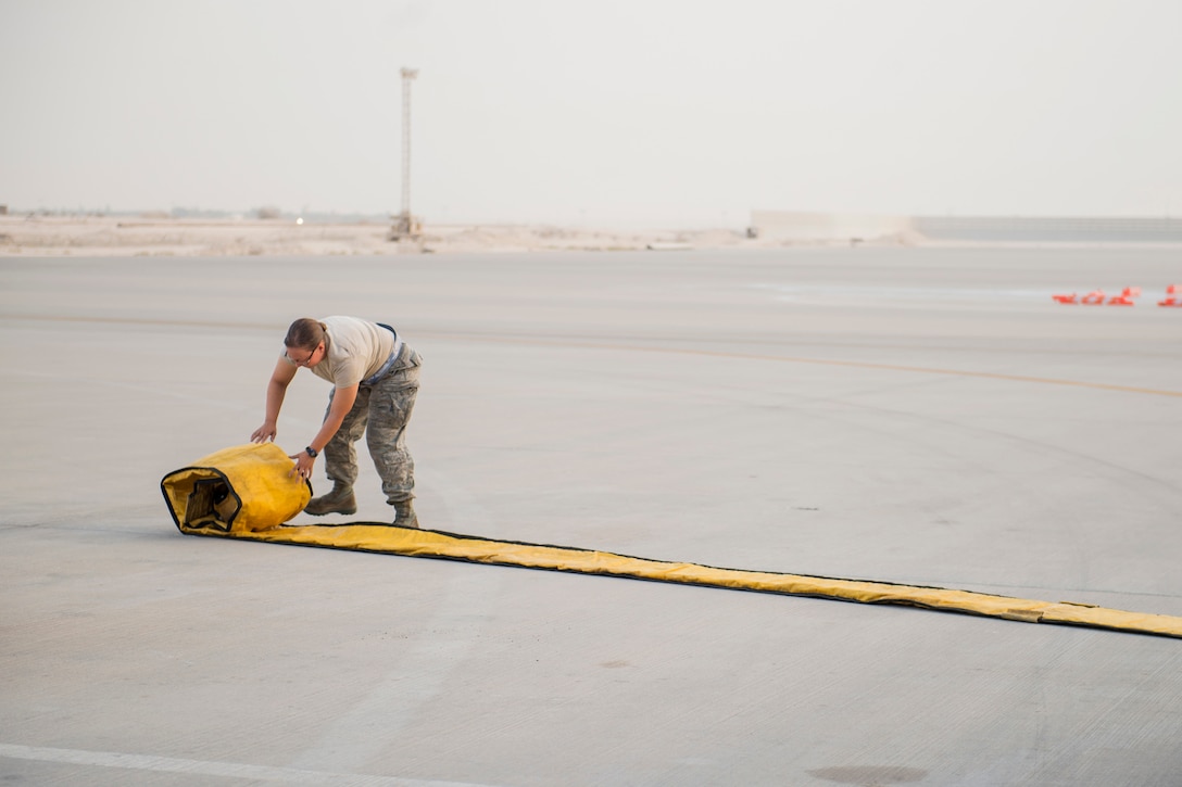 An airman assigned to the 379th Expeditionary Aircraft Maintenance Squadron prepares an air conditioning unit before preflight checks on a KC-135 Stratotanker aircraft on Al Udeid Air Base, Qatar, July 18, 2017. Preflight checks are completed to ensure the aircraft is fully capable prior to takeoff. Air Force photo by Staff Sgt. Trevor T. McBride