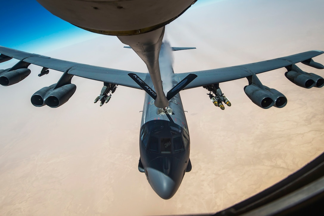 An Air Force B-52 Stratofortress aircraft receives fuel from a 340th Expeditionary Air Refueling Squadron KC-135 Stratotanker during a flight in support of Operation Inherent Resolve, July 18, 2017. The B-52 is a long-range, heavy bomber capable of flying at altitudes up to 50,000 feet. Air Force photo by Staff Sgt. Trevor T. McBride