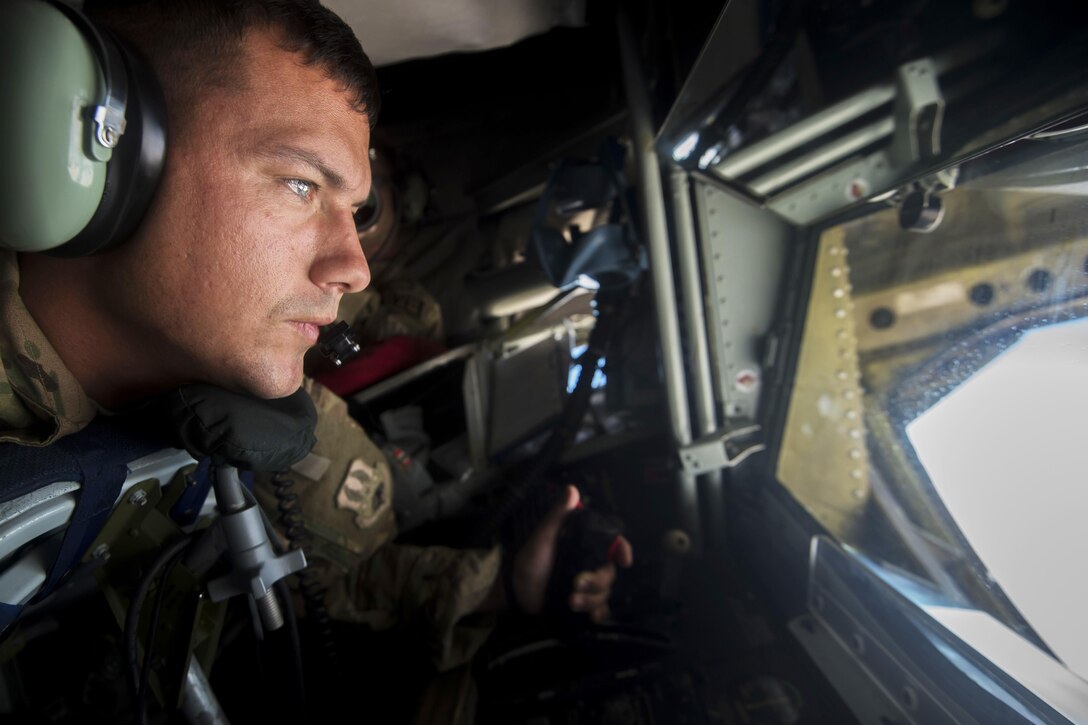 A boom operator, assigned to the 340th Expeditionary Air Refueling Squadron, prepares to refuel an aircraft from a KC-135 Stratotanker aircraft above Southwest Asia, July 18, 2017. The KC-135 provides refueling capabilities for Operation Inherent Resolve in the U.S. Central Command area of responsibility. Air Force photo by Staff Sgt. Trevor T. McBride