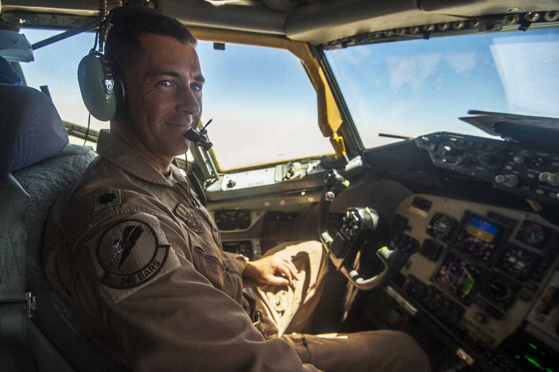 A KC-135 Stratotanker aircraft pilot talks with his co-pilot before a flight in support of Operation Inherent Resolve on Al Udeid Air Base, Qatar, July 18, 2017. Air Force photo by Staff Sgt. Trevor T. McBride