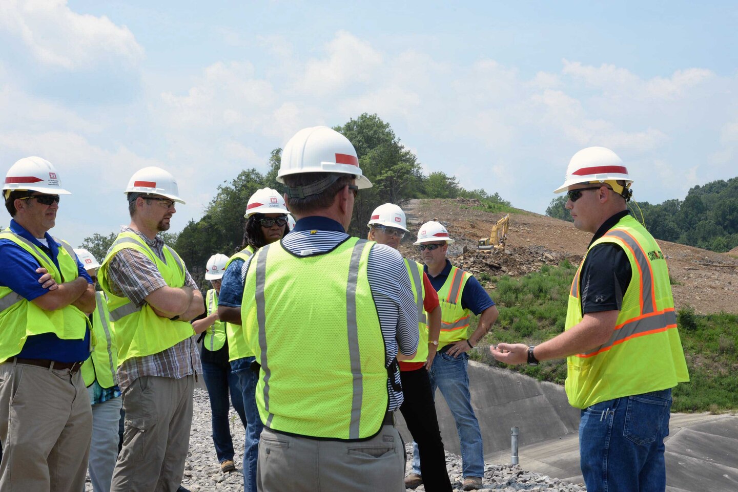U.S. Army Engineering and Support Center, Huntsville employees listen as Allan Malcomb with the Army Corps’ Nashville District explains ongoing efforts to shore up the saddle dam located at Center Hill Lake July 20.