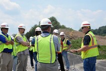 U.S. Army Engineering and Support Center, Huntsville employees listen as Allan Malcomb with the Army Corps’ Nashville District explains ongoing efforts to shore up the saddle dam located at Center Hill Lake July 20.
