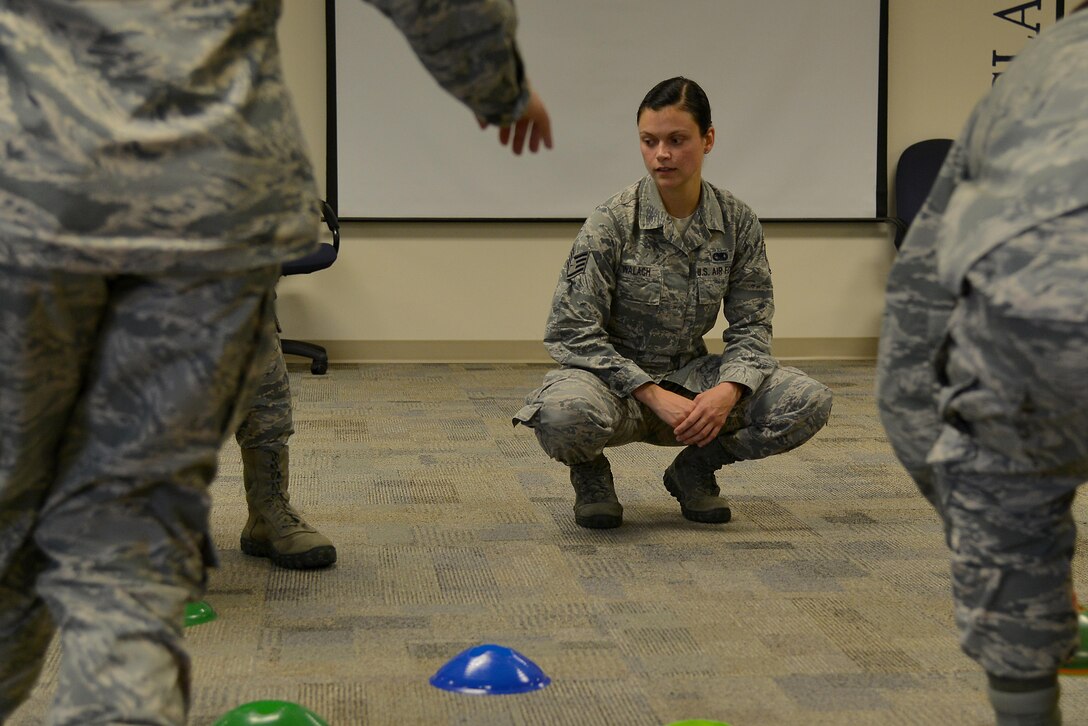 U.S. Air Force Staff Sgt. Codi Walach, First Term Airman Course team lead, supervises a team building exercise at Joint Base Langley-Eustis, Va., July 21, 2017. The U.S. Air Force made changes to the First Term Airman Course in late May, changing its focus from in-processing to being mission ready. 