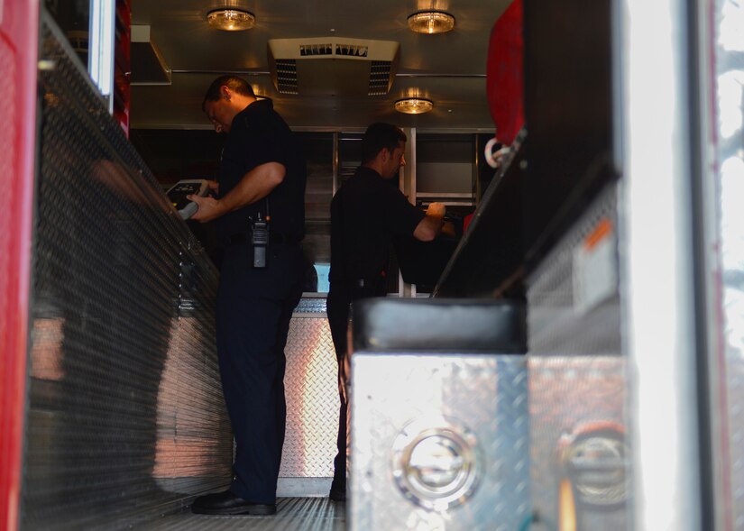 (From left) Tim Ketterman, Fort Eustis Fire and Emergency Services firefighter and hazmat specialist, and Lt. Peter Taylor, Fort Eustis Fire and Emergency Services lead firefighter, inspect equipment used to test hazardous materials at Joint Base Langley-Eustis, Va., July 20, 2017. Along with the HazMatID Elite chemical identifier, the team has eight other pieces of equipment, such as the BioThreat Alert Reader and Photoionization Detector that they are trained to use during hazardous situations. (U.S. Air Force photo/Airman 1st Class Kaylee Dubois)