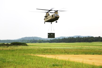 Soldiers with the 1st Battalion, 376th Aviation Regiment, 63rd Theater Aviation Brigade of the Nebraska Army National Guard move cargo with a Chinook helicopter July 21, 2017, during operations during the Patriot North 2017 Exercise at the Young Air Assault Trip at Fort McCoy, Wis. Patriot North is a training exercise designed for civilian emergency management and responders to work with military entities in the same manner that they would during disasters. 