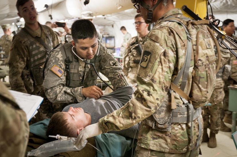 U.S. Army Reserve Spc. William S. Abella, a combat medic with the 331st Minimal Care Detachment out of Miami, checks the heartbeat of Spc. Zachary A. Morrill, a military policeman for the 304th Medical Company in Bluefield, West Virginia, during a mass casualty exercise at the 47th Combat Support Hospital on Camp Roberts, California, July 17, 2017. The CSH is part of the 84th Training Command’s Combat Support Training Exercise and the Army Medical Command’s Global Medic Exercise headquartered out of Fort Hunter Liggett, California. (U.S. Army Reserve photo by Spc. Miguel Alvarez, 354th Mobile Public Affairs Detachment)