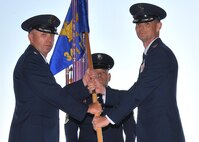 Col. David Miller, right, accepts command of the 341st Maintenance Group from Col. Ron Allen, 341st Missile Wing commander, July 26, 2017, at Malmstrom Air Force Base, Mont. Chief Master Sgt. Robert Rasmussen, 341 MXG superintendent, looks on. (U.S. Air Force photo/John Turner)