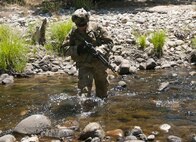 Pfc. Austin Broadway crosses a stream while maneuvering to an observation post near the 718th Engineer Company's command post during training on Fort Hunter Liggett, Calif., on July 19, 2017. The 718th is an Army Early Response Force unit, capable of deploying within 30 days of notification to support any combatant command in the world. Nearly 5,400 service members from the U.S. Army Reserve Command, U.S. Army, Army National Guard, U.S. Navy, and Canadian Armed Forces are training at Fort Hunter Liggett as part of the 84th Training Command’s CSTX 91-17-03 and ARMEDCOM’s Global Medic; this is a unique training opportunity that allows U.S. Army Reserve units to train alongside their multi-component and joint partners as part of the America’s Army Reserve evolution into the most lethal Federal Reserve force in the history of the nation. (U.S. Army Reserve photo by Sgt. David L. Nye, 301st Public Affairs Detachment)