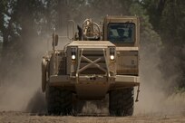 Spc. Dylan Sugg, a horizontal engineer with the 718th Engineer Company, scrapes the terrain of the company's temporary motor pool at Fort Hunter Liggett, Calif., during training on July 19, 2017. The scraper allowed the Soldier to get the motor pool more level to ease loading and unloading operations, but it also protected him from potential small arms fire from opposing forces in the training. Nearly 5,400 service members from the U.S. Army Reserve Command, U.S. Army, Army National Guard, U.S. Navy, and Canadian Armed Forces are training at Fort Hunter Liggett as part of the 84th Training Command’s CSTX 91-17- 03 and ARMEDCOM’s Global Medic; this is a unique training opportunity that allows U.S. Army Reserve units to train alongside their multi-component and joint partners as part of the America’s Army Reserve evolution into the most lethal Federal Reserve force in the history of the nation. (U.S. Army Reserve photo by Sgt. David L. Nye, 301st Public Affairs Detachment)