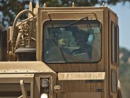 Spc. Dylan Sugg, a horizontal engineer with the 718th Engineer Company, scrapes the terrain of the company's temporary motor pool at Fort Hunter Liggett, Calif., during training on July 19, 2017. The scraper allowed the Soldier to get the motor pool more level to ease loading and unloading operations, but it also protected him from potential small arms fire from opposing forces in the training. Nearly 5,400 service members from the U.S. Army Reserve Command, U.S. Army, Army National Guard, U.S. Navy, and Canadian Armed Forces are training at Fort Hunter Liggett as part of the 84th Training Command’s CSTX 91-17- 03 and ARMEDCOM’s Global Medic; this is a unique training opportunity that allows U.S. Army Reserve units to train alongside their multi-component and joint partners as part of the America’s Army Reserve evolution into the most lethal Federal Reserve force in the history of the nation. (U.S. Army Reserve photo by Sgt. David L. Nye, 301st Public Affairs Detachment)