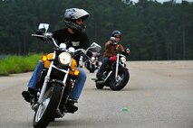 Team Shaw members navigate motorcycles through markers during a Motorcycle Safety Foundation intermediate training course at Shaw Air Force Base, S.C., July 26, 2017.  The 20th Fighter Wing occupational safety office continually hosts an intermediate class and a basic rider course for military members and civilians with base access. Per Department of Defense mandate, all military members riding motorcycles must receive motorcycle operator safety training regularly. Motorcycle safety information is available for Air Force members in Air Force Instruction 91-207. (U.S. Air Force photo by Airman 1st Class Kathryn R.C. Reaves)