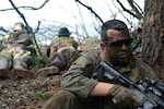 Sgt. Anthony Coppola, an assistant team leader assigned to Charlie Troop, 2nd Squadron, 101st Cavalry Regiment of the New York Army National Guard, stands guard at an observation post at Shoalwater Bay, Queensland, Australia, during exercise Talisman Saber, July 14, 2017. He is wearing a mix of Australian and American uniform items because of the unit's role as opposing force. Soldiers from the battalion were in Australia participating in a series of exercises alongside Australian and New Zealand Forces. 