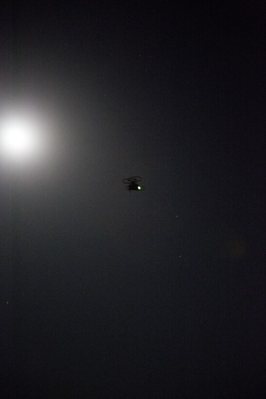A Joint Tactical Aerial Resupply Vehicle (JTARV) flies through the night with cargo it retrieved from a Marine Special Operations Team (MSOT) with 1st Marine Raider Support Battalion, U.S. Marine Corps Forces, Special Operations Command, aboard Marine Corps Base Camp Pendleton, Calif., July 11. The JTARV, which is in the developmental phase, is a lightweight autonomous vehicle which provides an aerial resupply capability for immediate support to operational units. It was being tested as a resupply platform for machine-gun sustainment training with a cargo unmanned logistics system (C-ULS) during their TRX.