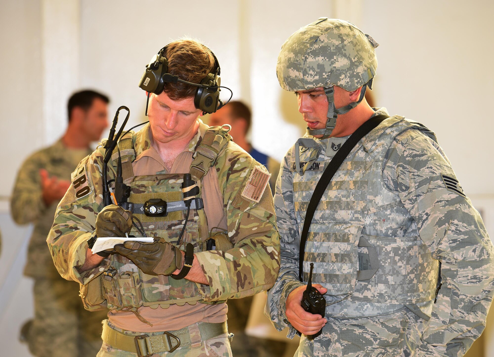 First Lt. Ryan Kelly, 38th Rescue Squadron combat rescue officer, works with Staff Sgt. Jesse Ouverson, 45th Security Forces Squadron defender, to assess the victims of an active shooter exercise incident July 25, 2017 in Hangar 750. Kelly, who is on temporary duty with the 308th Rescue Squadron, and the pararescue team oversaw the care of the victims until the 45th Civil Engineer Squadron firefighters arrived. The exercise, which ran early morning through mid afternoon, was a joint endeavor between the host 45th Space Wing and 920th Rescue Wing. (U.S. Air Force photo/Tech. Sgt. Lindsey Maurice)