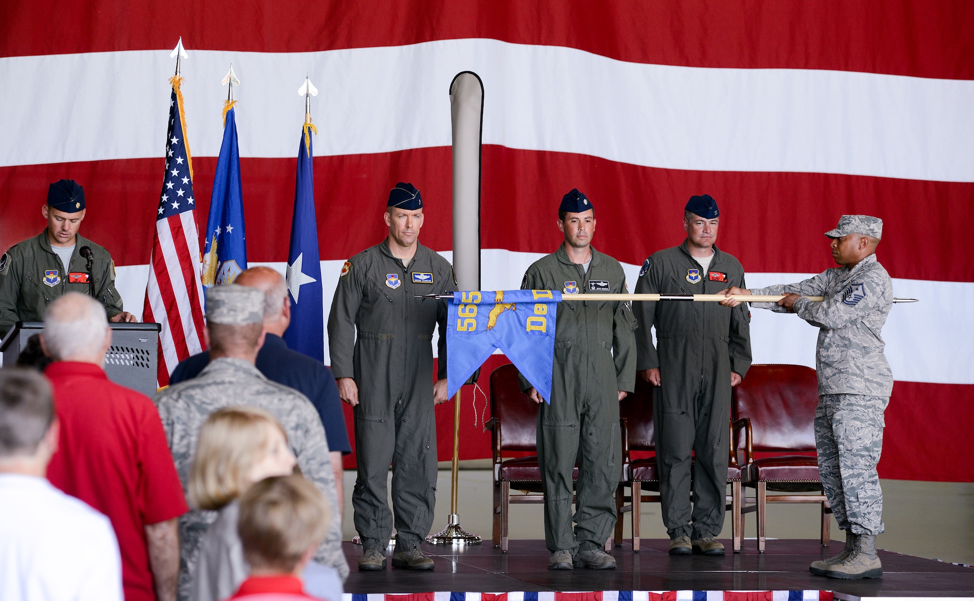 U.S. Air Force members from the 173rd Fighter Wing and 550th Fighter Squadron, stand at attention as the Detachment 2 flag is rolled up during an activation ceremony, July 21, 2017, at Kingsley Field in Klamath Falls, Oregon. The active duty Air Force detachment assigned to Kingsley Field, previously Detachment 2, is now officially designated as the 550th Fighter Squadron. 550th Fighter Squadron members will continue to fall under the command of the 56th Operations Group at Luke Air Force Base, Arizona. (U.S. Air National Guard photo by Staff Sgt. Penny Snoozy)