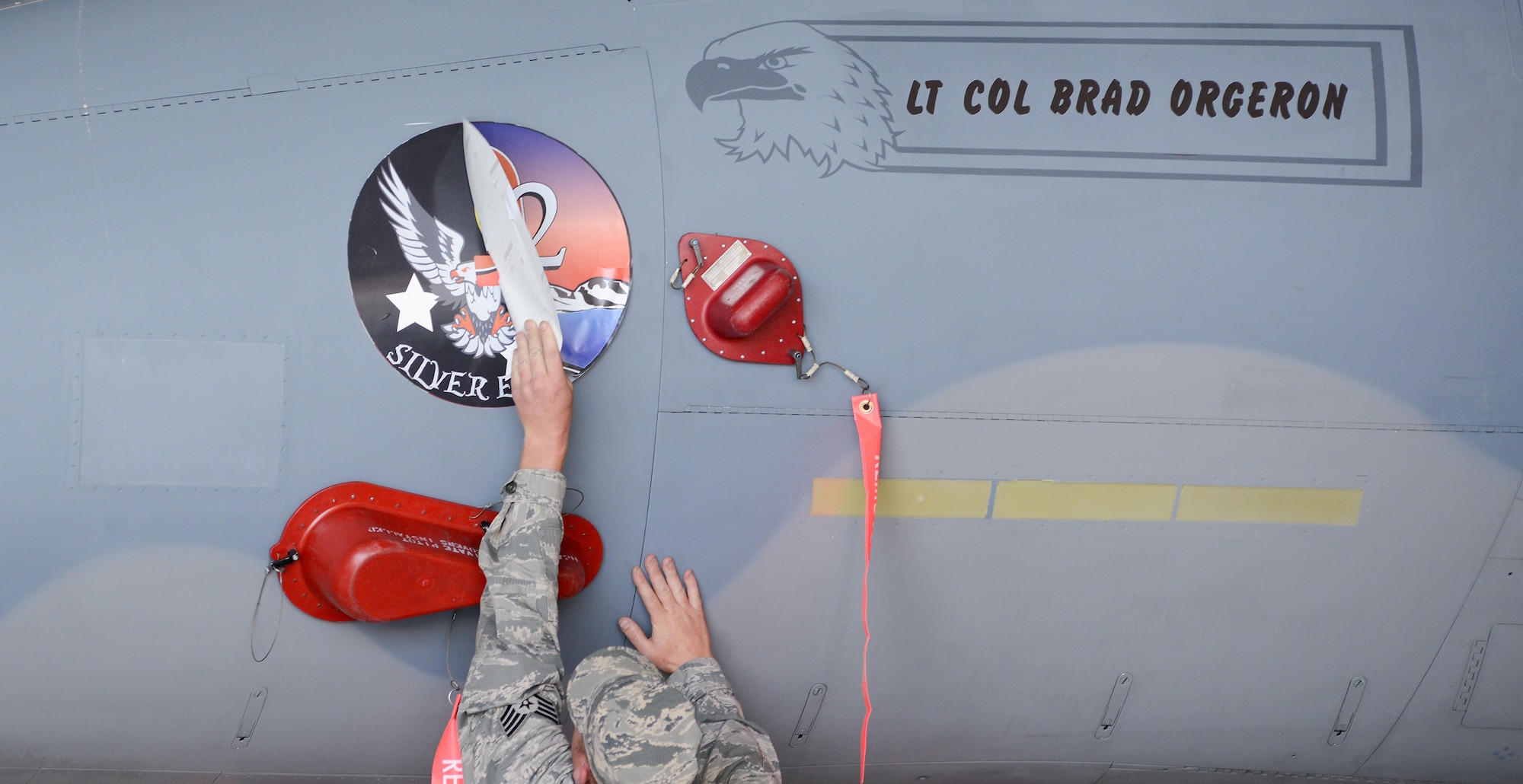 An Airman from the 550th Fighter Squadron reveals the new squadron patch during an activation ceremony, July 21, 2017, at Kingsley Field in Klamath Falls, Oregon. The active duty Air Force detachment based out of the Kingsley Field, previously known as Detachment 2, is now officially designated as the 550th Fighter Squadron. 550th Fighter Squadron members will continue to fall under the command of the 56th Operations Group at Luke Air Force Base, Arizona. (U.S. Air National Guard photo by Staff Sgt. Penny Snoozy)