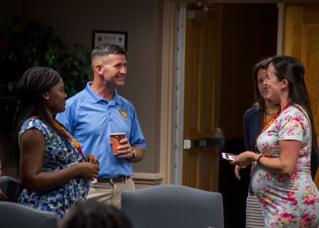 Colonel Jeffery C. Smitherman, Commanding Officer of 6th Marine Corps District (6MCD), speaks with spouses during the District Spouse Orientation Course (DSOC) at Irby’s Inn aboard Marine Corps Air Station Beaufort, South Carolina, July 25, 2017.  The DSOC provided Marines and their spouses a broad spectrum of tools to help them transition into the Marine Corps’ recruiting field. The spouses came from across the District to build connections and network with fellow spouses. (U.S. Marine Corps photo by Lance Cpl. Jack A. E. Rigsby)
