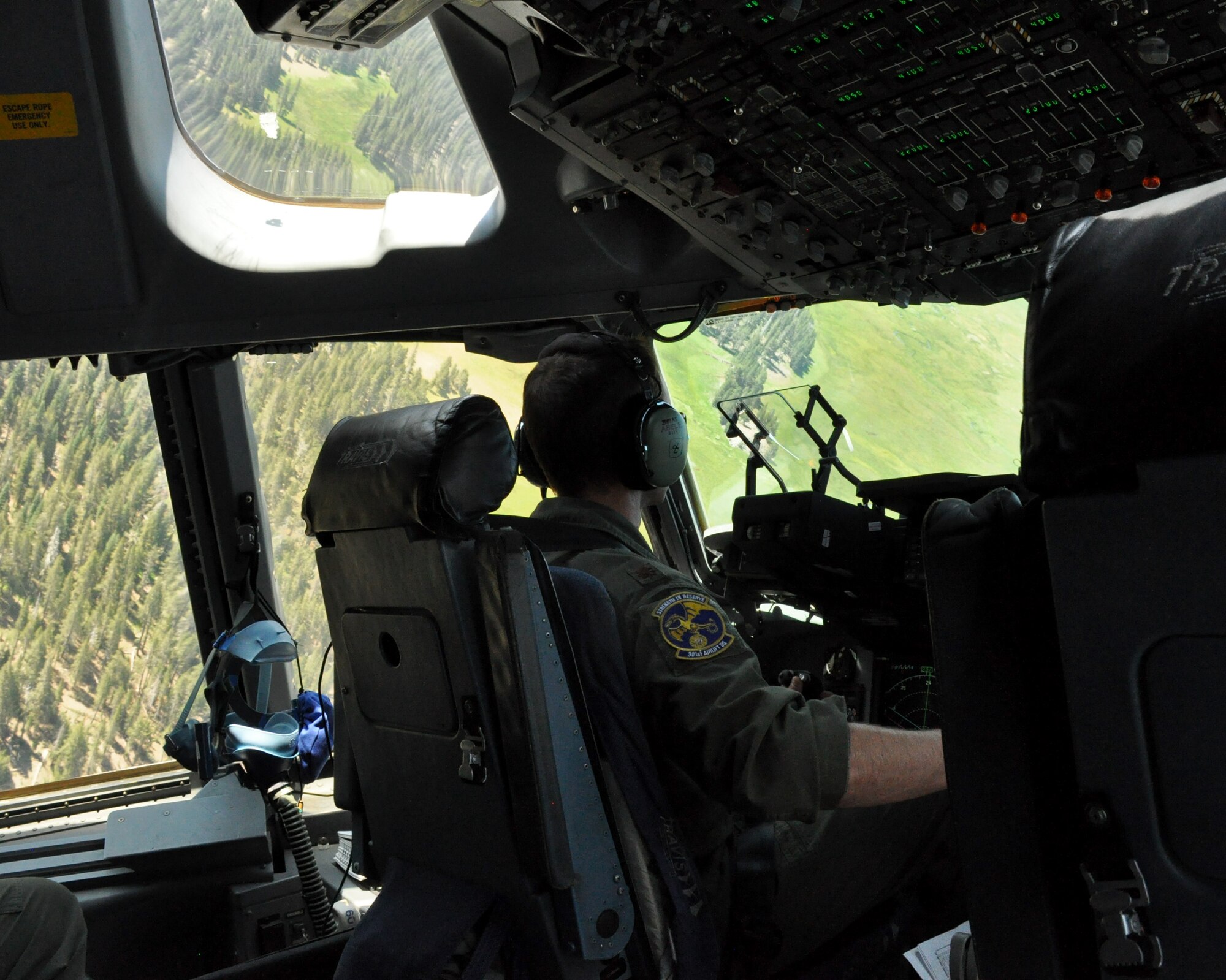Maj. Matthew Abele, a 301st Airlift Squadron C-17 Globemaster III pilot, performs low-level flying and terrain-masking techniques over northern California on July 22, 2017. The flight was performed in conjunction with the 349th Air Mobilty Wing's Patriot Wyvern exercise. (U.S. Air Force photo by Senior Airman Shelby R. Horn/Released)