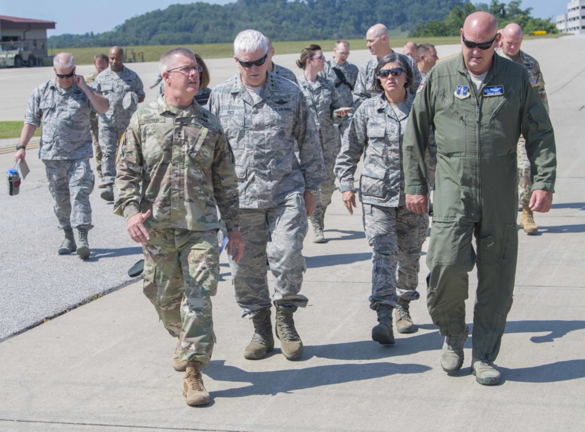 Maj. Gen. James A. Hoyer, the Adjutant General of the West Virginia National Guard, walks alongside Director of the Air National Guard, Lt. Gen. L. Scott Rice, Assistant Adjutant for Air, Brig. Gen. Paige Hunter, and 130th Airlift Wing commander, Col. Johnny Ryan during a visit to McLaughlin Air National Guard Base July 26, 2017. Rice and Air National Guard Command Chief Master Sgt. Ronald Anderson gained insight into the 130th AW mission and recognized the accomplishments of some of the unit’s outstanding Airmen through a coining ceremony. (U.S. Air National Guard photo by Tech. Sgt. De-Juan Haley) 