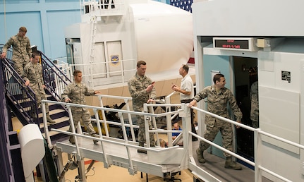 Reserve Officer Training Corps cadets enter the C-5 flight simulator at the 733rd Training Squadron, July 26, 2017 at Joint Base San Antonio-Lackland. The cadets also visited the 433rd Maintenance Squadron's engine shop and received a C-5M Super Galaxy aircraft tour. (U.S. Air Force photo by Benjamin Faske)