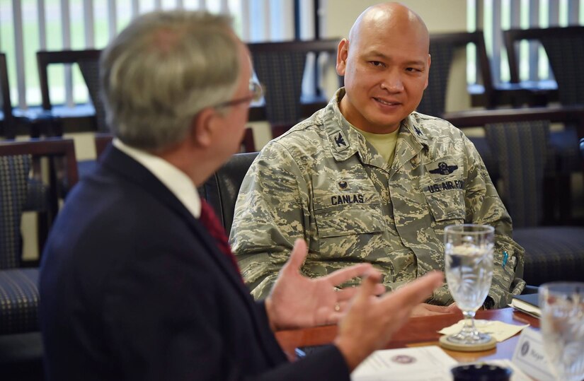 Col. Jimmy Canlas, right, 437th Airlift Wing commander, talks to Charleston Mayor John Tecklenburg, left, during a joint base mission briefing as part of a site visit here, July 25. The locations Tecklenburg toured included the Naval Health Clinic Charleston, the Naval Nuclear Power Training Command and the 841st Transportation Battalion. Tecklenburg was selected to represent the installation at the Joint Civilian Orientation Conference in August 2017. The mission of JCOC is to increase public understanding of national defense by enabling American business and community leaders to directly observe and engage with the U.S. military. 