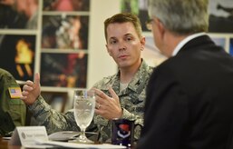 Col. Jeff Nelson, left, 628th Air Base Wing commander, talks to Charleston Mayor John Tecklenburg, right, during a joint base mission briefing as part of a site visit here, July 25. The locations Tecklenburg toured included the Naval Health Clinic Charleston, the Naval Nuclear Power Training Command and the 841st Transportation Battalion. Tecklenburg was selected to represent the installation at the Joint Civilian Orientation Conference in August 2017. The mission of JCOC is to increase public understanding of national defense by enabling American business and community leaders to directly observe and engage with the U.S. military. 