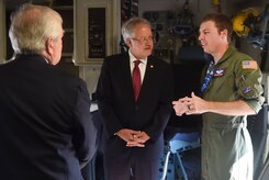 Charleston Mayor John Tecklenburg, center, talks to Staff Sgt. Cody Skidmore, right, 15th Airlift Squadron loadmaster, during a tour of a C-17 Globemaster III as part of a site visit here, July 25. The locations Tecklenburg toured included the Naval Health Clinic Charleston, the Naval Nuclear Power Training Command and the 841st Transportation Battalion. Tecklenburg was selected to represent the installation at the Joint Civilian Orientation Conference in August 2017. The mission of JCOC is to increase public understanding of national defense by enabling American business and community leaders to directly observe and engage with the U.S. military. 