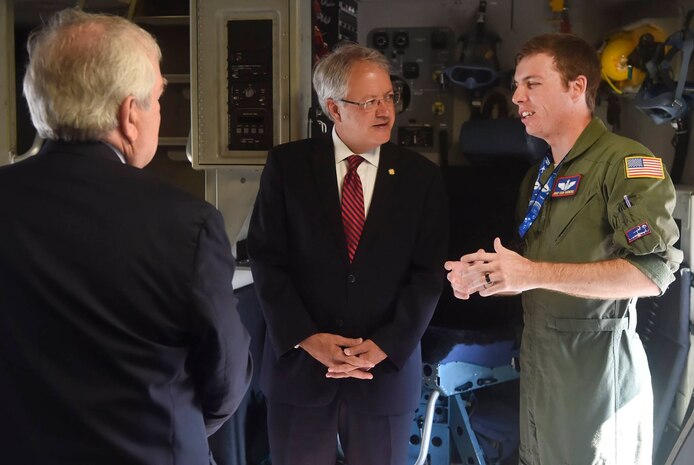 Charleston Mayor John Tecklenburg, center, talks to Staff Sgt. Cody Skidmore, right, 15th Airlift Squadron loadmaster, during a tour of a C-17 Globemaster III as part of a site visit here, July 25. The locations Tecklenburg toured included the Naval Health Clinic Charleston, the Naval Nuclear Power Training Command and the 841st Transportation Battalion. Tecklenburg was selected to represent the installation at the Joint Civilian Orientation Conference in August 2017. The mission of JCOC is to increase public understanding of national defense by enabling American business and community leaders to directly observe and engage with the U.S. military. 