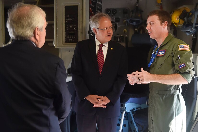 Charleston Mayor John Tecklenburg, center, talks to Staff Sgt. Cody Skidmore, right, 15th Airlift Squadron loadmaster, during a tour of a C-17 Globemaster III as part of a site visit here, July 25. The locations Tecklenburg toured included the Naval Health Clinic Charleston, the Naval Nuclear Power Training Command and the 841st Transportation Battalion. Tecklenburg was selected to represent the installation at the Joint Civilian Orientation Conference in August 2017. The mission of JCOC is to increase public understanding of national defense by enabling American business and community leaders to directly observe and engage with the U.S. military. 