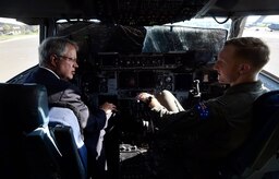 Australian Royal air force Flt. Lt. Timothy Burnard, right, C-17 Globemaster III pilot, shares his experience as a C-17 pilot with Charleston Mayor John Tecklenburg, left, ta during a site visit here, July 25. The locations Tecklenburg toured included the Naval Health Clinic Charleston, the Naval Nuclear Power Training Command and the 841st Transportation Battalion. Tecklenburg was selected to represent the installation at the Joint Civilian Orientation Conference in August 2017. The mission of JCOC is to increase public understanding of national defense by enabling American business and community leaders to directly observe and engage with the U.S. military. 