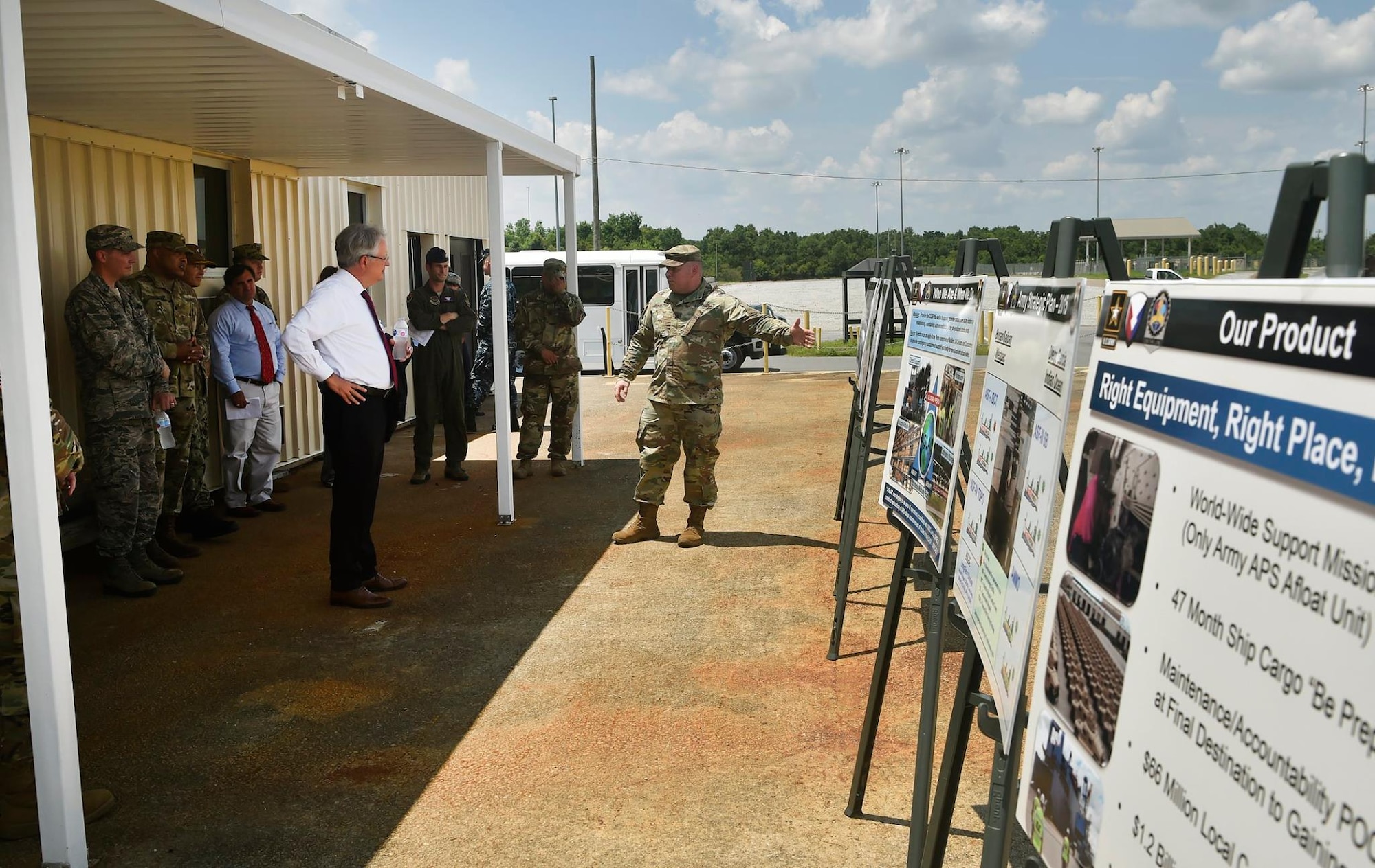 U.S. Army Lt. Col. Chad Blacketer, 841st Transportation Battalion commander, provides a mission briefing for Charleston Mayor John Tecklenburg, left, and Joint Base Charleston leadership at the Naval Weapons Station Charleston during a site visit here, July 25. The locations Tecklenburg toured included the Naval Health Clinic Charleston, the Naval Nuclear Power Training Command and the 841st Transportation Battalion. Tecklenburg was selected to represent the installation at the Joint Civilian Orientation Conference in August 2017. The mission of JCOC is to increase public understanding of national defense by enabling American business and community leaders to directly observe and engage with the U.S. military. 